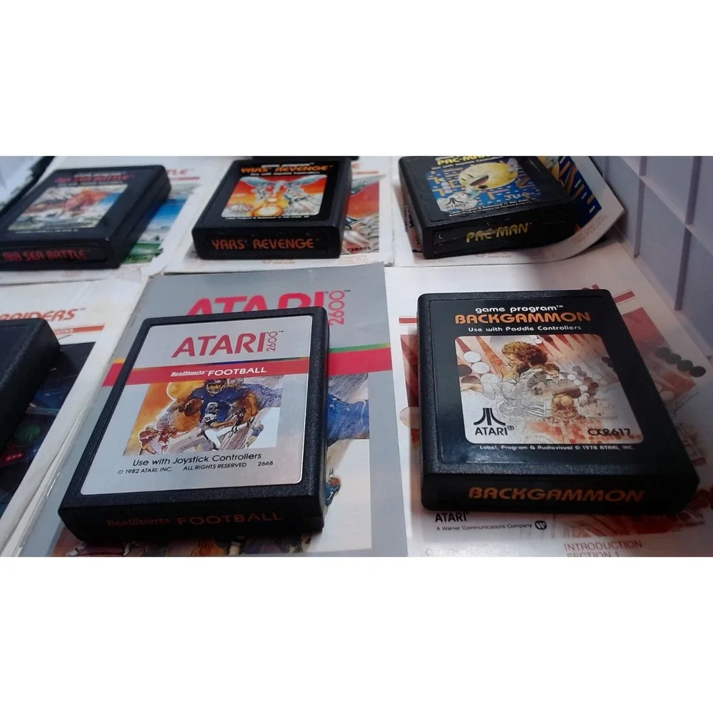 Lot of 7 Atari 2600 Games with Manuals Star Raiders Pac-Man Yars Revenge NTSC